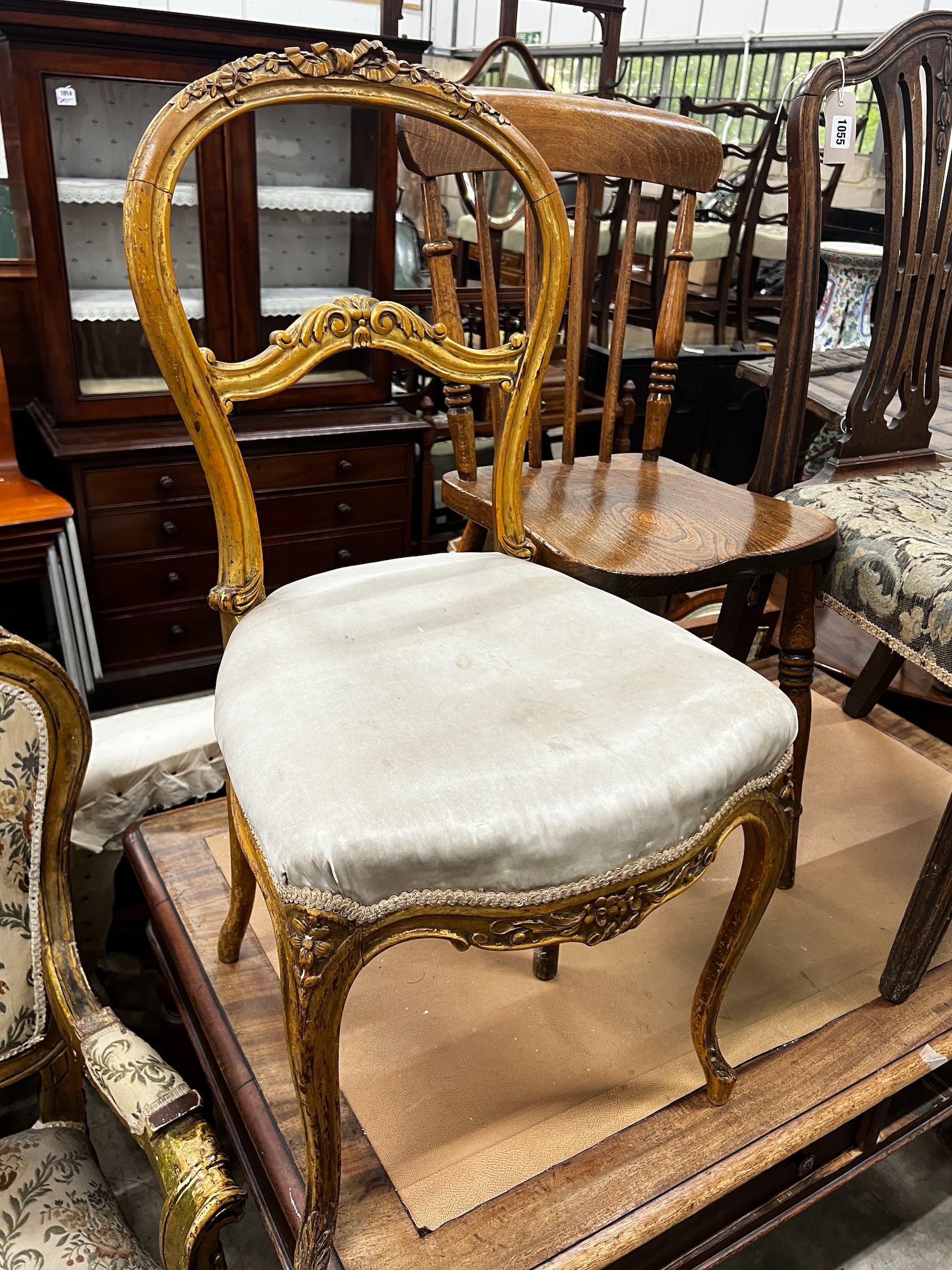 A George III mahogany dining chair, A Victorian elm and beech Windsor kitchen chair and a giltwood balloon back chair